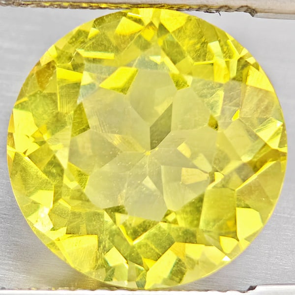 Natural Yellow Lemon Quartz Gemstones 6.32 Ct. Round Shape 12.2 Mm.: Product ID: 805530146 Product Name: Natural Quartz Weight: 6.32 CT. Size: 12.2 x 12.2 x 8 MM. Shape: Round Shape Color: Yellow Lemon Clarity:VSI Luster: Good Gems Origin: Brazil Treatment: Unheated Cr