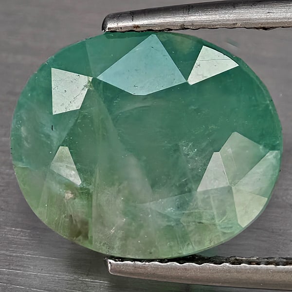 Natural Green Blueish Grandidierite Gemstones 7.45 Ct. Oval Shape 13 x 11 Mm.: Product ID: 803100064 Product Name: Natural Tsavorite Weight: 7.45 CT. Size: 13 x 11 x 8.7 MM. Shape: Oval Shape Color: Green Blueish Clarity:SI1 Luster: Good Gems Origin: Madagascar Treatment: Unheat