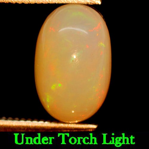 Natural Multi Color Play Of Colour Opal Gemstones 2.38 Ct. Oval Cabochon Shape 11.2 x 7.2 Mm.: Product ID: 818725762 Product Name: Natural Opal Weight: 2.38 CT. Size: 11.2 x 7.2 x 5.6 MM. Shape: Oval Cabochon Color: Multi Color Clarity:Semi - Transparent Luster: Iridescent Gems Origin: Ethiopia