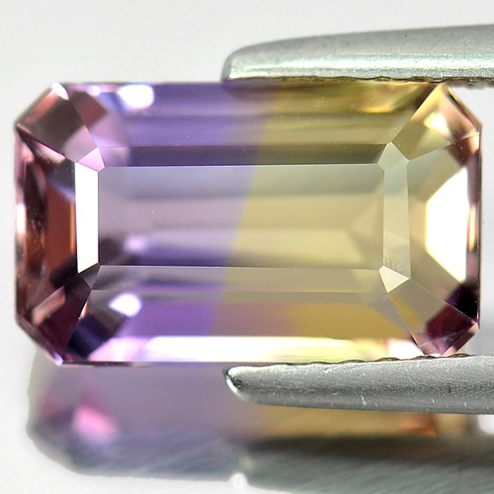 Natural Bi Color Ametrine Gemstones 3.40 Ct. Octagon Shape 11.1 x 6.8 Mm.: Product ID: 800405090 Product Name: Natural Ametrine Weight: 3.40 CT. Size: 11.1 x 6.8 x 5.7 MM. Shape: Octagon Color: Bi Color Clarity:VVS Luster: Good Gems Origin: Bolivia Treatment: Unheated Crysta