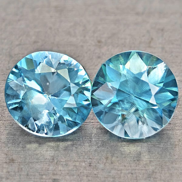 Natural Blue Zircon Gemstones 1.21 Ct. 2 Pcs Round Diamond Cut 4.9 Mm.: Product ID: 807743033 Product Name: Natural Zircon Weight: 1.21 CT. Size: 4.9 x 4.9 x 3.4 MM. Shape: Round Diamond Cut Color: Blue Clarity:VSI Luster: Good Gems Origin: Cambodia Treatment: Heated Crys