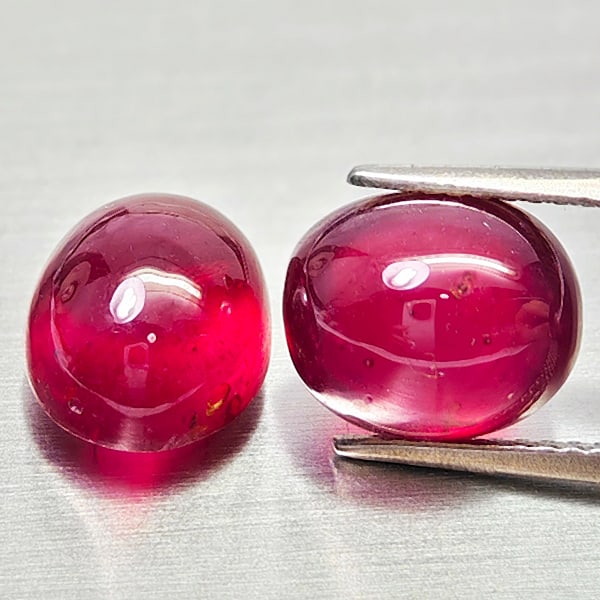 Natural Purplish Red Ruby Gemstones 10.96 Ct. 2 Pcs. Oval Cabochon Shape: Product ID: 805935244 Product Name: Natural Ruby Weight: 10.96 CT. Size: 10.2 x 8.1 x 6.4 to 9.7 x 8.1 x 6.7 MM. Shape: Oval Cabochon Color: Purplish Red Clarity:Semi - Transparent Luster: Good Gems O