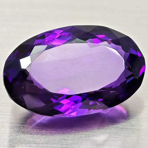 Natural Purple Amethyst Gemstones 14.26 Ct. Oval Shape 19 x 11.9 Mm.: Product ID: 800325486 Product Name: Natural Amethyst Weight: 14.26 CT. Size: 19 x 11.9 x 9.7 MM. Shape: Oval Color: Purple Clarity:VSI Luster: Good Gems Origin: Brazil Treatment: Unheated Crystal Stru