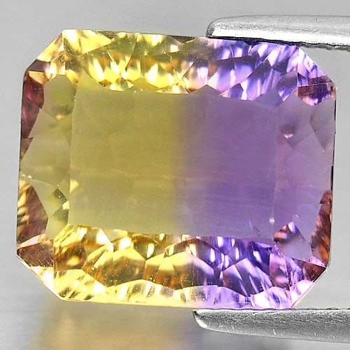 Natural Bi Color Ametrine Gemstones 8.08 Ct. Octagon Millennium Cut 12.7 x 11 Mm.: Product ID: 800408005 Product Name: Natural Ametrine Weight: 8.08 CT. Size: 12.7 x 11 x 7.3 MM. Shape: Octagon Millennium Cut Color: Bi Color Clarity:IF Luster: Very Good Gems Origin: Bolivia Treatmen