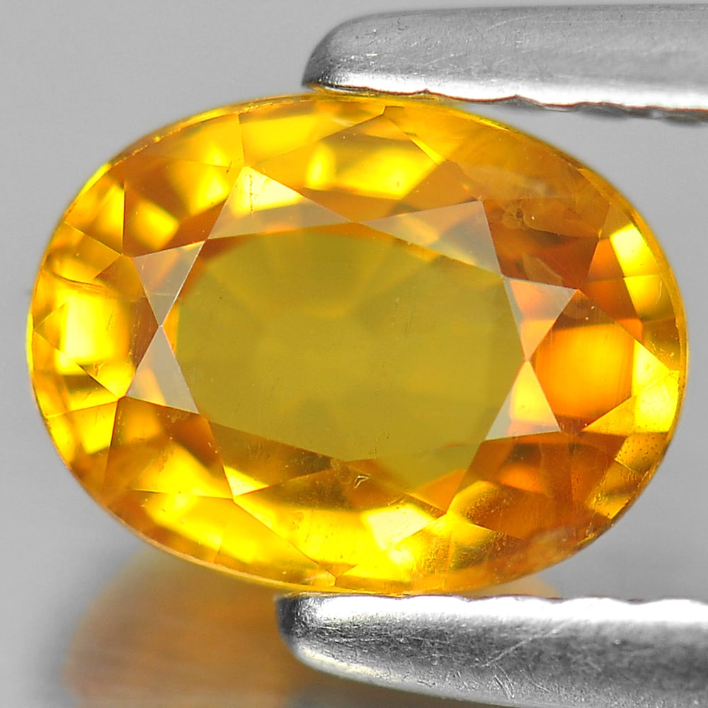 Natural Yellow Sapphire Gemstones 1.02 Ct. Oval Shape 6.8 x 5.2 Mm.: Product ID: 806155996 Product Name: Natural Yellow Sapphire Weight: 1.02 CT. Size: 6.8 x 5.2 x 3.2 MM. Shape: Oval Color: Yellow Clarity:VSI Luster: Very Good Gems Origin: Thailand Treatment: Heated C