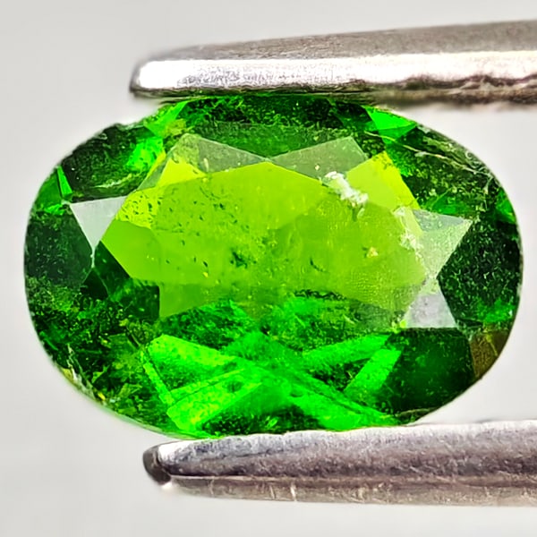 Natural Green Chrome Diopside Gemstones 0.77 Ct. Oval Shape 7 x 5.1 Mm.: Product ID: 801608152 Product Name: Natural Chrome Diopside Weight: 0.77 CT. Size: 7 x 5.1 x 2.8 MM. Shape: Oval Color: Green Clarity:VSI - SI1 Luster: Good Gems Origin: Russia Treatment: Unheated Cry