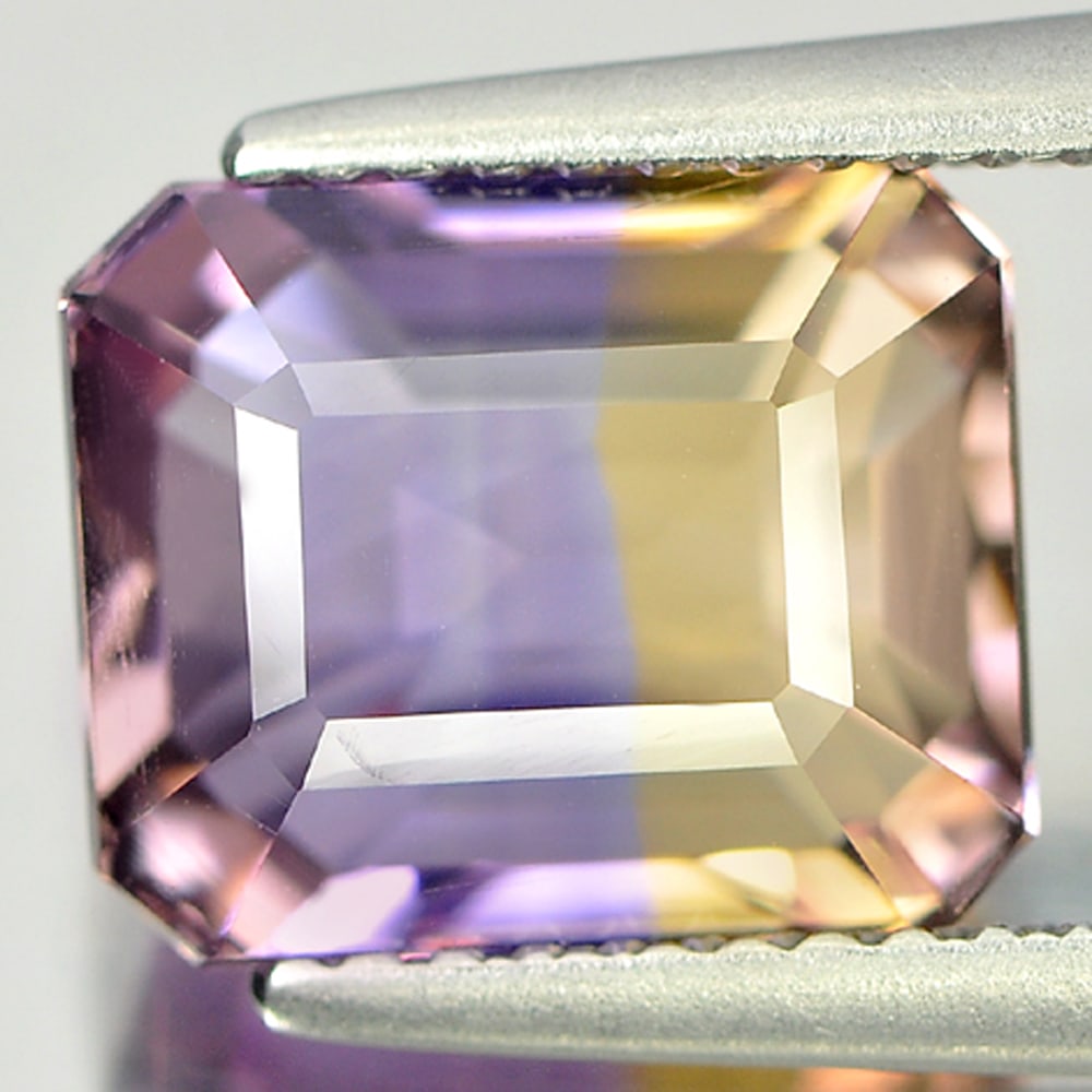 Natural Bi Color Ametrine Gemstones 3.85 Ct. Octagon Shape 10.1 x 8.4 Mm.: Product ID: 800405221 Product Name: Natural Ametrine Weight: 3.85 CT. Size: 10.1 x 8.4 x 6.4 MM. Shape: Octagon Color: Bi Color Clarity:VVS Luster: Good Gems Origin: Bolivia Treatment: Unheated Crysta