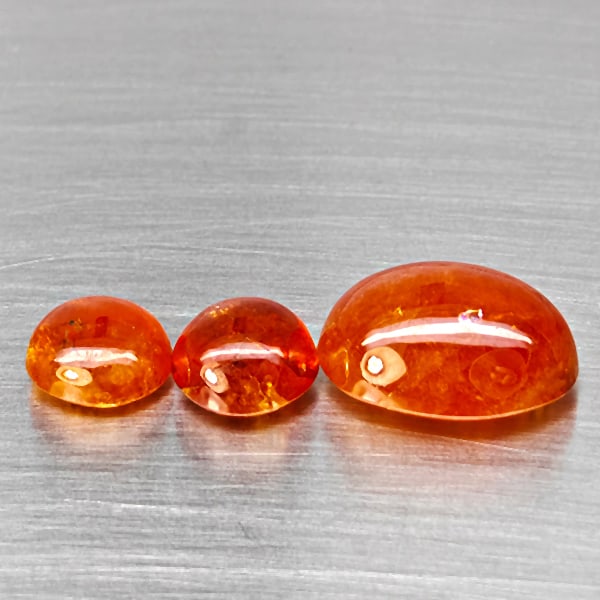 Natural Orangish Red Spessartine Garnet Gemstones 23.29 Ct. 3 Pcs. Mixed Cabochon Shape and Mixed: Product ID: 802938037 Product Name: Natural Garnet Weight: 23.29 CT. Size: 15.6 x 11.8 x 7.8 to 9 x 9 x 4.7 MM. Shape: Mixed Shape Color: Orangish Red Clarity:SI1 Luster: Good Gems Origin: Namibia Tre