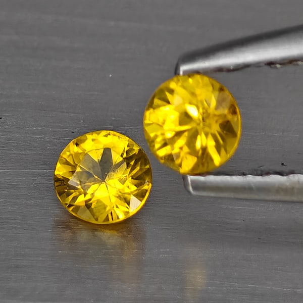 Natural Yellow Songea Sapphire Gemstones 0.41 Ct. 2 Pcs. Round Diamond Cut 3.5 Mm.: Product ID: 806130506 Product Name: Natural Blue Sapphire Weight: 0.41 CT. Size: 3.5 x 3.5 x 2.6 MM. Shape: Round Diamond Cut Color: Yellow Clarity:SI1 Luster: Good Gems Origin: Tanzania Treatment: He