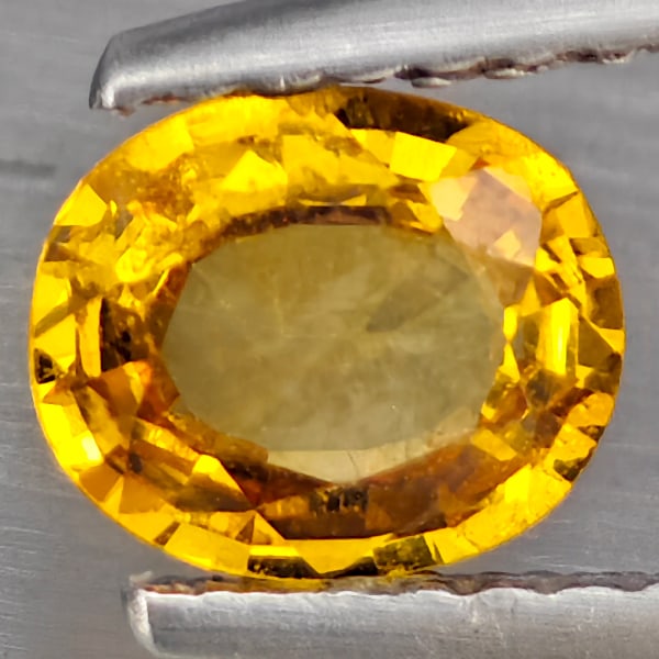 Natural Yellow Sapphire Gemstones 0.75 Ct. Oval Shape 6.3 x 5.3 Mm.: Product ID: 806130475 Product Name: Natural Yellow Sapphire Weight: 0.75 CT. Size: 6.3 x 5.3 x 2.8 MM. Shape: Oval Color: Yellow Clarity:SI1 Luster: Good Gems Origin: Thailand Treatment: Heated Crysta