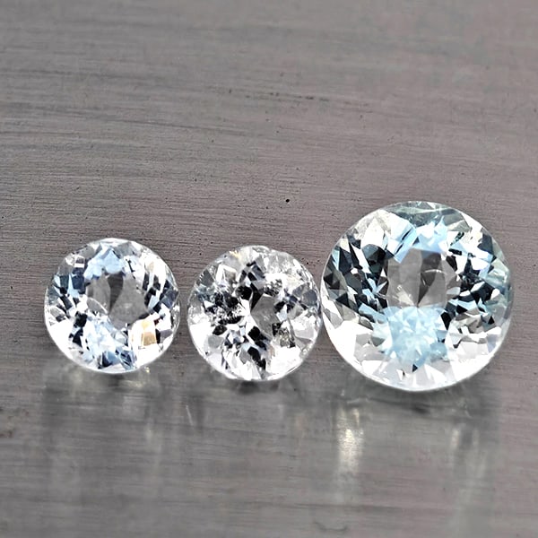 Natural Baby Blue Aquamarine Gemstones 1.93 Ct. 3 Pcs. Round Shape and Mixed Size: Product ID: 800812469 Product Name: Natural Aquamarine Weight: 1.93 CT. Size: 6.9 x 6.9 x 4.6 to 4.9 x 4.9 x 3.5 MM. Shape: Round Shape Color: Baby Blue Clarity:SI1 Luster: Good Gems Origin: Brazil Tr