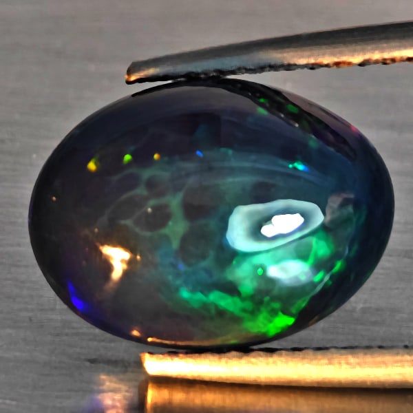 Natural Multi Color Play Of Colour Opal Gemstones 3.12 Ct. Oval Cabochon Shape 12.6 x 9.4 Mm.: Product ID: 818728587 Product Name: Natural Opal Weight: 3.12 CT. Size: 12.6 x 9.4 x 5.4 MM. Shape: Oval Cabochon Shape Color: Multi-Color Clarity:Semi - Transparent Luster: Good Gems Origin: Ethiopia