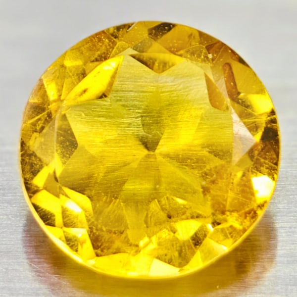 Natural Yellow Citrine Gemstones 0.84 Ct. Round Shape 7 Mm.: Product ID: 801813555 Product Name: Natural Citrine Weight: 0.84 CT. Size: 7 x 7 x 3.6 MM. Shape: Round Color: yellow Clarity:VVS Luster: Good Gems Origin: Barzil Treatment: Unheated Crystal Structure