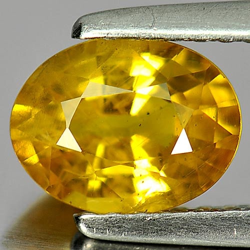 Natural Yellow Sapphire Gemstones 1.48 Ct. Oval Shape 7.8 x 6 Mm.: Product ID: 806153986 Product Name: Natural Yellow Sapphire Weight: 1.48 CT. Size: 7.8 x 6 x 3.9 MM. Shape: Oval Color: Yellow Clarity:VSI Luster: Good Gems Origin: Thailand Treatment: Heated Crystal 