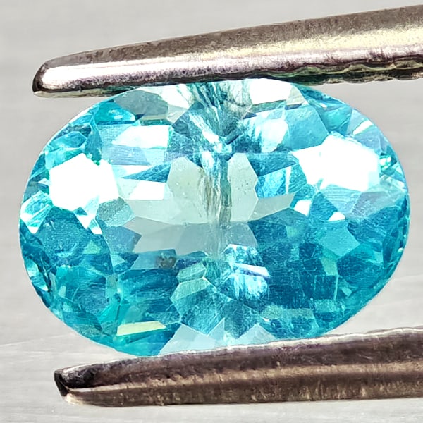 Natural Paraiba Color Apatite Gemstones 0.85 Ct. Oval Shape 6.9 x 5.1 Mm.: Product ID: 800613723 Product Name: Natural Apatite Weight: 0.85 CT. Size: 6.9 x 5.1 x 3.7 MM. Shape: Oval Color: Neon Blue Clarity:VSI Luster: Good Gems Origin: Tanzania Treatment: Unheated Crystal S