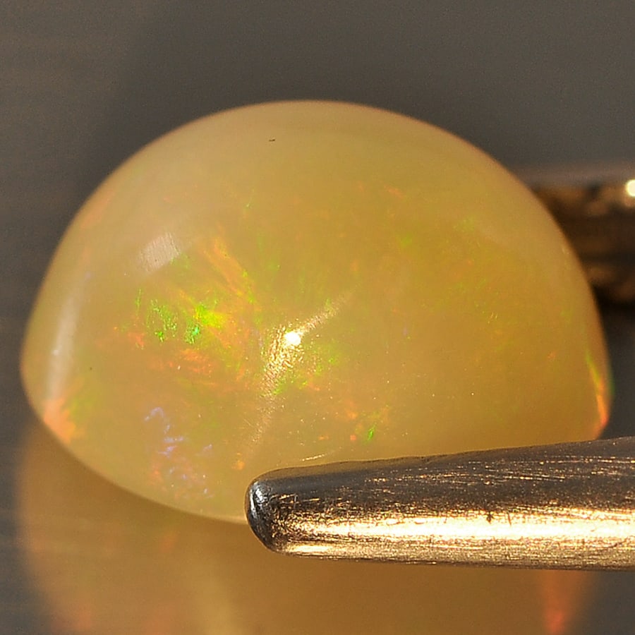 Natural Multi Color Opal Gemstones 1.32 Ct. Oval Cabochon Shape 8 x 6.1 Mm.: Product ID: 818710112 Product Name: Natural Opal Weight: 1.32 CT. Size: 8 x 6.1 x 5.2 MM. Shape: Oval Cabochon Color: Multi Color Clarity:Semi - Transparent Luster: Good Gems Origin: Ethiopia Treatmen
