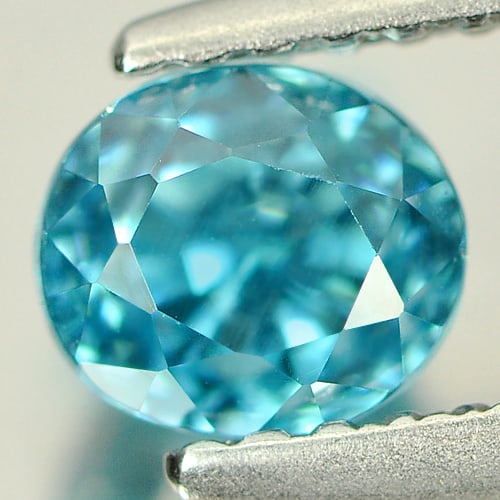Natural Blue Zircon Gemstones 1.39 Ct. Clean Oval Shape 5.5 x 4.8 Mm.: Product ID: 807712865 Product Name: Natural Zircon Weight: 1.39 CT. Size: 5.5 x 4.8 x 5.2 MM. Shape: Oval Color: Blue Clarity:IF Luster: Good Gems Origin: Cambodia Treatment: Heated Crystal Structure: