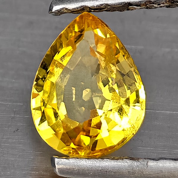 Natural Yellow Sapphire Gemstones 0.62 Ct. Pear Shape 6 x 4.9 Mm.: Product ID: 806130468 Product Name: Natural Yellow Sapphire Weight: 0.62 CT. Size: 6 x 4.9 x 2.9 MM. Shape: Pear Shape Color: Yellow Clarity:SI1 Luster: Good Gems Origin: Thailand Treatment: Heated Cr