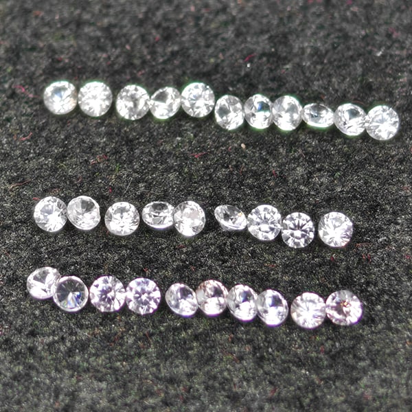 Natural White Zircon Gemstones 0.62 Ct. 30 Pcs. Round Diamond Cut 1.5 Mm.: Product ID: 807743103 Product Name: Natural Zircon Weight: 0.62 CT. Size: 1.5 x 1.5 x 1.2 MM. Shape: Round Diamond Cut Color: White Clarity:VSI Luster: Good Gems Origin: Cambodia Treatment: Heated Cry