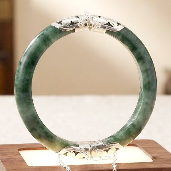 Natural Green Jade Gemstones Bangle 339.74 Ct. Diameter 60 Mm. With 925 Sterling Silver: Product ID: 819816373 Product Name: Natural Gemstones Weight: 339.74 CT. Size: 60 MM. Shape: Round Cabochon Shape Color: Multi-Color Clarity:Semi - Transparent Luster: None Gems Origin: Thailand Treat