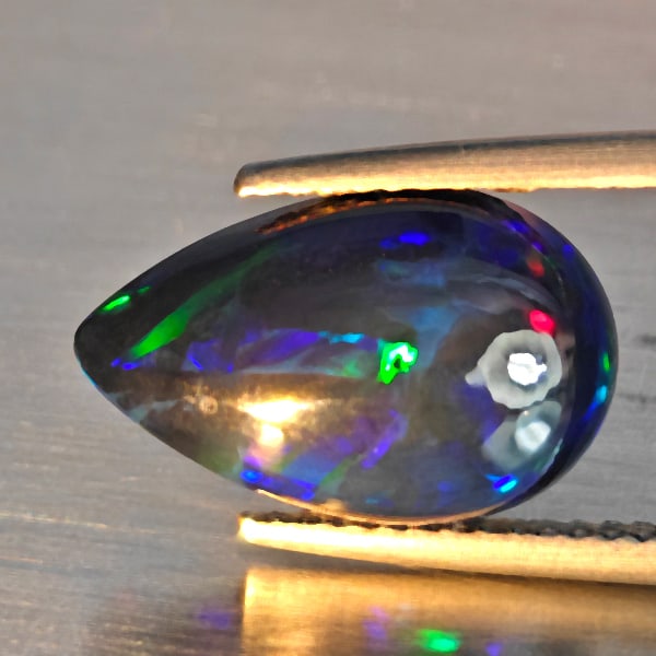 Natural Multi Color Play Of Colour Opal Gemstones 2.80 Ct. Pear Cabochon Shape 14.6 x 9.3 Mm.: Product ID: 818728556 Product Name: Natural Opal Weight: 2.80 CT. Size: 14.6 x 9.3 x 5 MM. Shape: Pear Cabochon Shape Color: Multi-Color Clarity:Semi - Transparent Luster: Good Gems Origin: Ethiopia T
