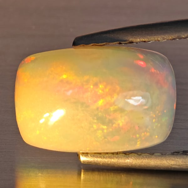 Natural Multi-Color Play Of Colour Opal Gemstone 2.10 Ct. Octagon Cabochon Shape 11.4 x 7.5 Mm: Product ID: 708700122 Product Name: Natural Opal Weight: 2.10 CT. Size: 11.4 x 7.5 x 4.6 MM. Shape: Octagon Cabochon Color: Multi-Color Clarity:Opaque Luster: Good Gems Origin: Ethiopia Treatment: Unh
