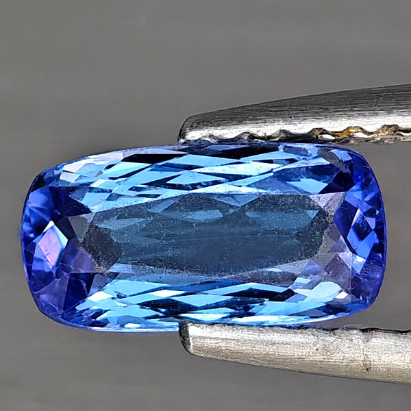 Natural Violetish Blue Tanzanite Gemstones 0.98 Ct. Cushion Shape 8.7 x 4.4 Mm.: Product ID: 807004244 Product Name: Natural Tanzanite Weight: 0.98 CT. Size: 8.7 x 4.4 x 3 MM. Shape: Cushion Shape Color: Violetish Blue Clarity:VVS - VSI Luster: Good Gems Origin: Tanzania Treatment