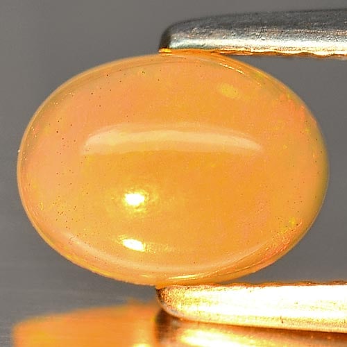 Natural Multi Color Play Of Colour Opal Gemstones 0.78 Ct. Oval Cabochon Shape 8 x 6 Mm.: Product ID: 818726269 Product Name: Natural Opal Weight: 0.78 CT. Size: 8 x 6 x 3.5 MM. Shape: Oval Cabochon Color: Multi Color Clarity:Semi - Transparent Luster: Iridescent Gems Origin: Ethiopia Trea