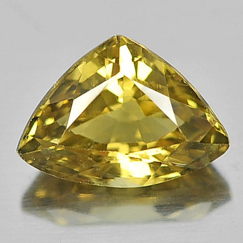 Natural Yellow Chrysoberyl Gemstones 1.02 Ct. Trilliant Shape 7.4 x 5.4 Mm.: Product ID: 801701107 Product Name: Natural Chrysoberyl Weight: 1.02 CT. Size: 7.4 x 5.4 x 3.8 MM. Shape: Trilliant Color: Yellow Clarity:VSI Luster: Good Gems Origin: Madagascar Treatment: Unheated C