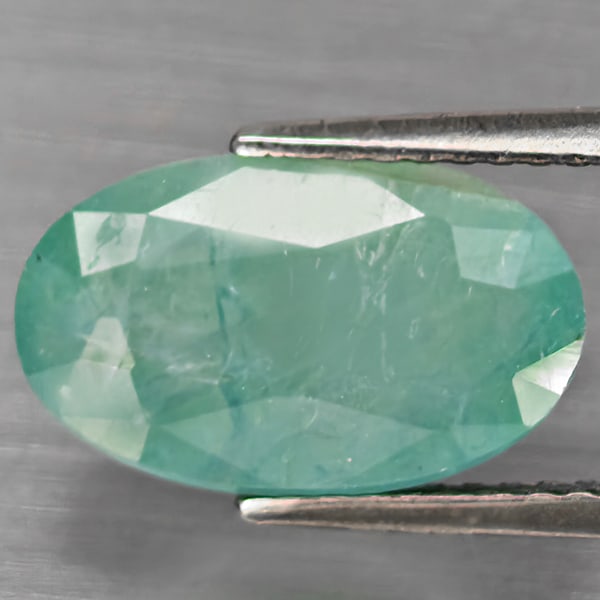 Natural Green Blueish Grandidierite Gemstones 5.20 Ct. Oval Shape 13 x 7.8 Mm.: Product ID: 803100060 Product Name: Natural Tsavorite Weight: 5.20 CT. Size: 13 x 7.8 x 7.4 MM. Shape: Oval Shape Color: Green Blueish Clarity:SI1 Luster: Good Gems Origin: Madagascar Treatment: Unhea