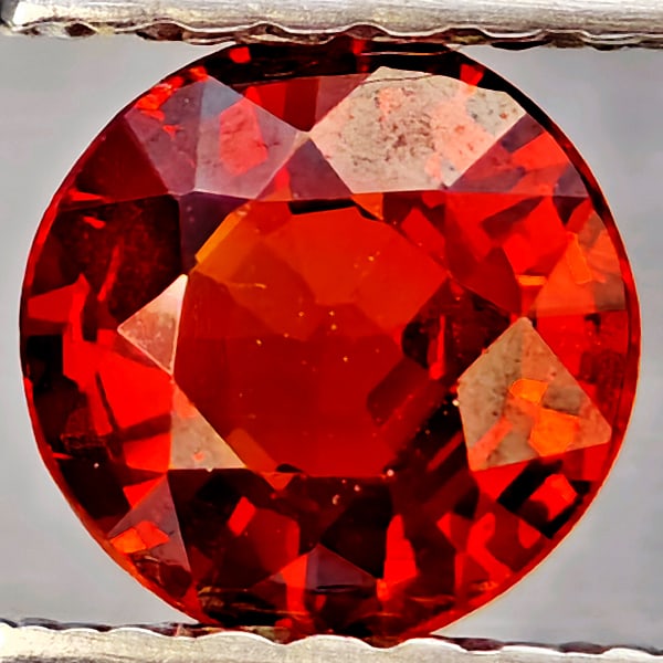Natural Orangish Red Spessartine Garnet Gemstones 0.78 Ct. Round Shape 5.4 Mm.: Product ID: 802937325 Product Name: Natural Garnet Weight: 0.78 CT. Size: 5.4 x 5.4 x 2.8 MM. Shape: Round Shape Color: Orangish Red Clarity:SI1 Luster: Good Gems Origin: Namibia Treatment: Unheated C