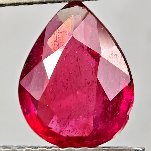 Natural Purplish Red Ruby Gemstones 1.83 Ct. Pear Shape 9.1 x 7.2 Mm.: Product ID: 805935535 Product Name: Natural Ruby Weight: 1.83 CT. Size: 9.1 x 7.2 x 3.4 MM. Shape: Pear Shape Color: Purplish Pink Clarity:VSI - SI1 Luster: Good Gems Origin: Madagascar Treatment: Hea