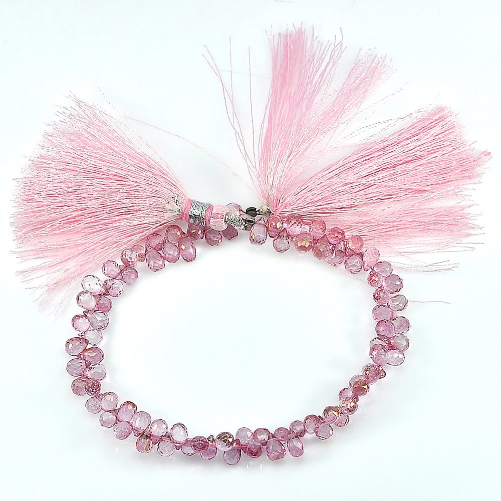 Natural Pink Topaz Gemstones Beads 73.50 Ct. Briolette Shape Length 8 Inch: Product ID: 807136417 Product Name: Natural Topaz Weight: 73.50 CT. Size: 8 Inch / 6.5 x 4.4 x 4.4 MM. Shape: Briolette With Drilled Color: Pink Clarity:IF - VVS Luster: Good Gems Origin: Brazil Treat