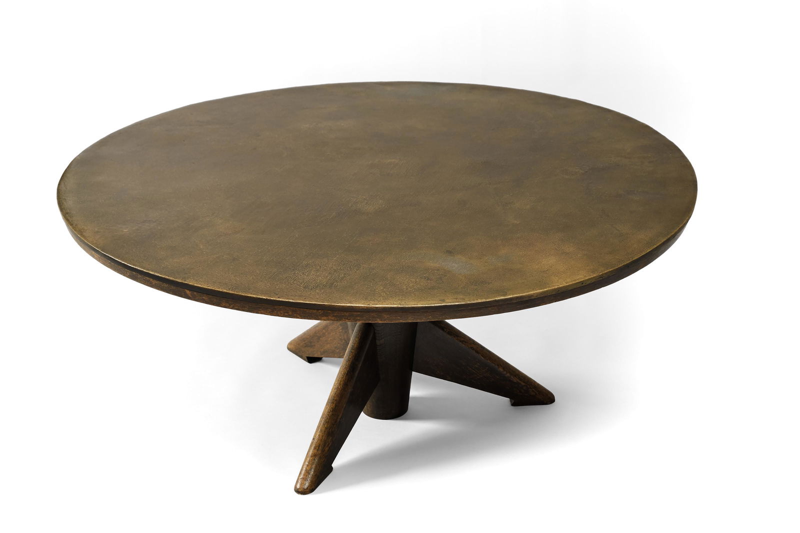 Emiel Veranneman (Belgian, 1924 - 2004): Unique Coffee Table - c.1965 Bronze and oak - Diam. 109 cm, H. 47 cm Unique piece Provenance: Emile Gilioli, Paris Private collection, Belgium Published: La Maison. Revue mensuelle d'architecture de d