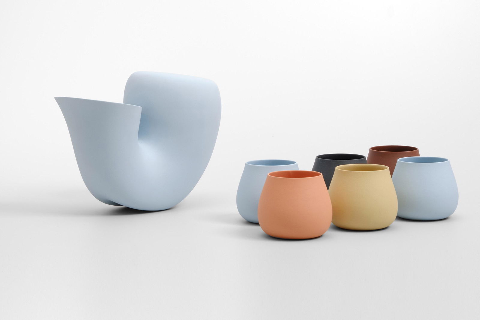 Aldo Bakker (Dutch, 1971): Water Carafe and Six Cups - 2011 Porcelain Carafe: 21 x 26 x 13 cm Cups: 7 x 9 Ã˜ cm From the Jug + Cup Tableware Collection for Particles Gallery