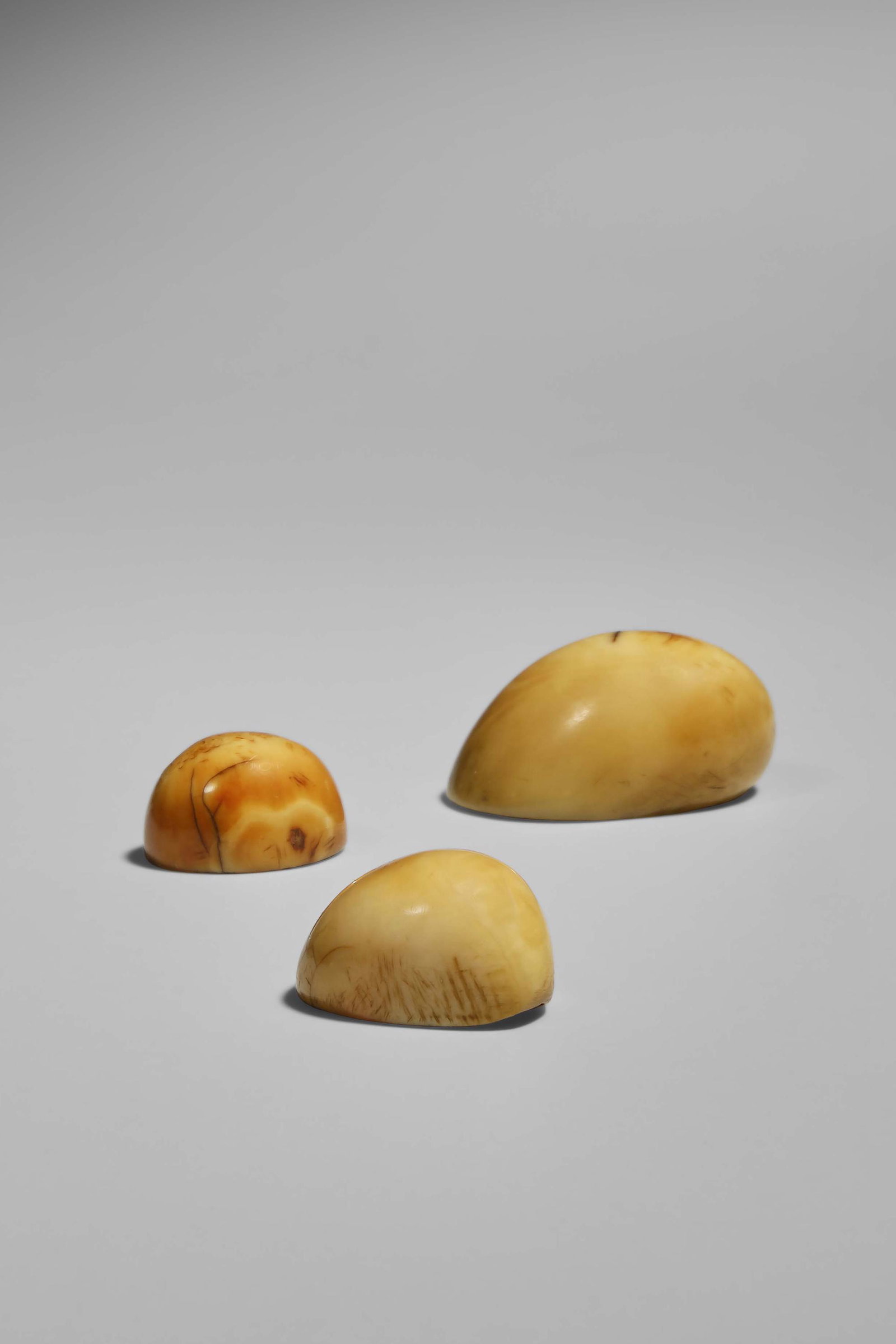 Three Kupe'e Palaoa - Hawai'ian Wrist Ornaments: Hawai'i Whalebone Largest: 3,2 cm Provenance: Kepoikai family collection, members of Maui ali'i Leo Fortess Collection, Kaneohe, HI Bonhams & Butterfields, San Francisco, Fine African, Oceanic