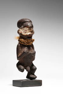 Yaka Figure: D.R. Congo Wood, pigment, and vegetal fibers 9 cm Provenance: Pierre Dartevelle, Brussels (2011) Marc Leo Felix, Brussels Private collection, Belgium