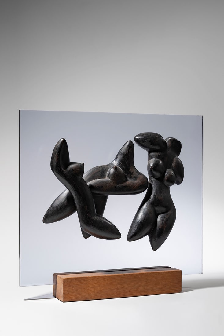 Man Ray (French, 1890 - 1976): Les Trois Nus / Les Trois Grâces - 1971 Ebony mounted on acrylic glass Acrylic glass: 54,3 x 63,2 cm Incised with the signature Man Ray and the numbering H.C. 0 Executed in 1971 in an edition