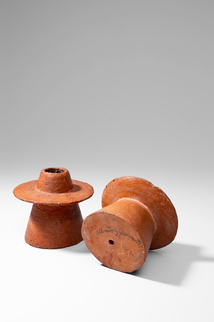 Alberto Giacometti (Swiss, 1901-1966): Pair of Conical Candleholders - 1930 Terracotta 8,8 x 10 cm and 9 x 10,2 cm One signed underneath: Alberto G. Giacometti Provenance: Claude and Sylvie Berri, Paris Private collection,