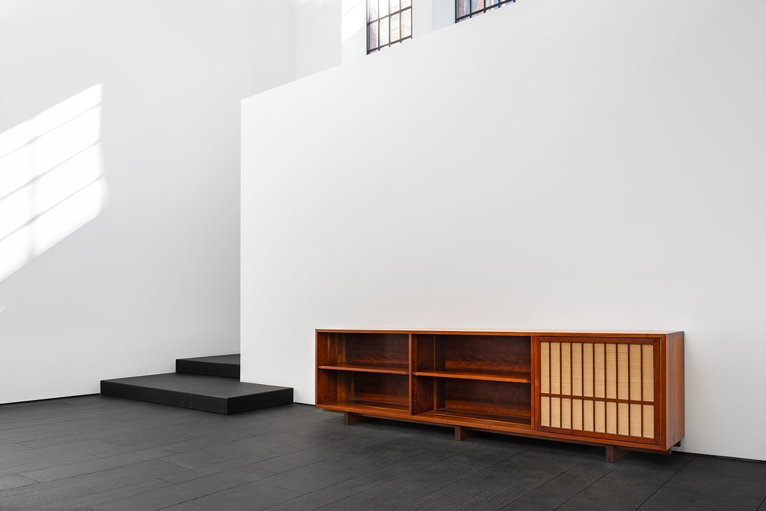 George Nakashima (American, 1905-1990): Cabinet -1958 Walnut and laurel wood, pandanus cloth 80 x 274 x 51 cm Provenance: From the estate of Dr. Seymour and Mrs. Phyllis Lifschutz, Princeton, New Jersey Private colle