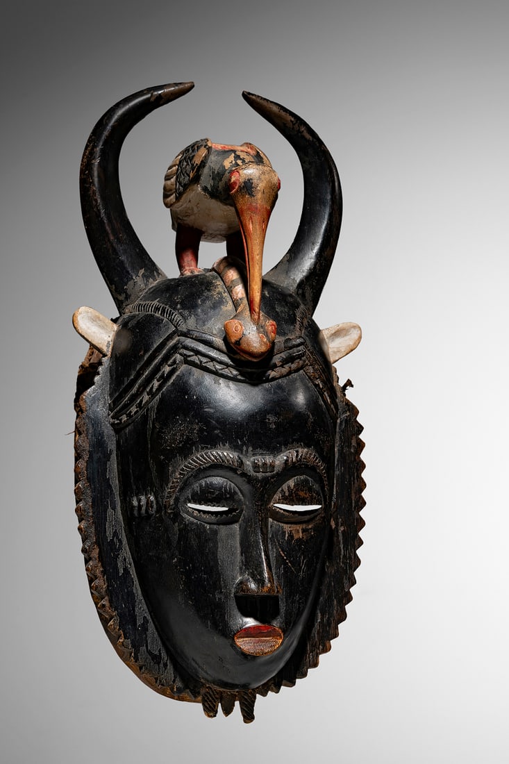 ‡ Yaure Baule Mask: Ivory Coast Wood and pigment 45 cm Provenance: Lucas Ratton, Paris Private collection, London