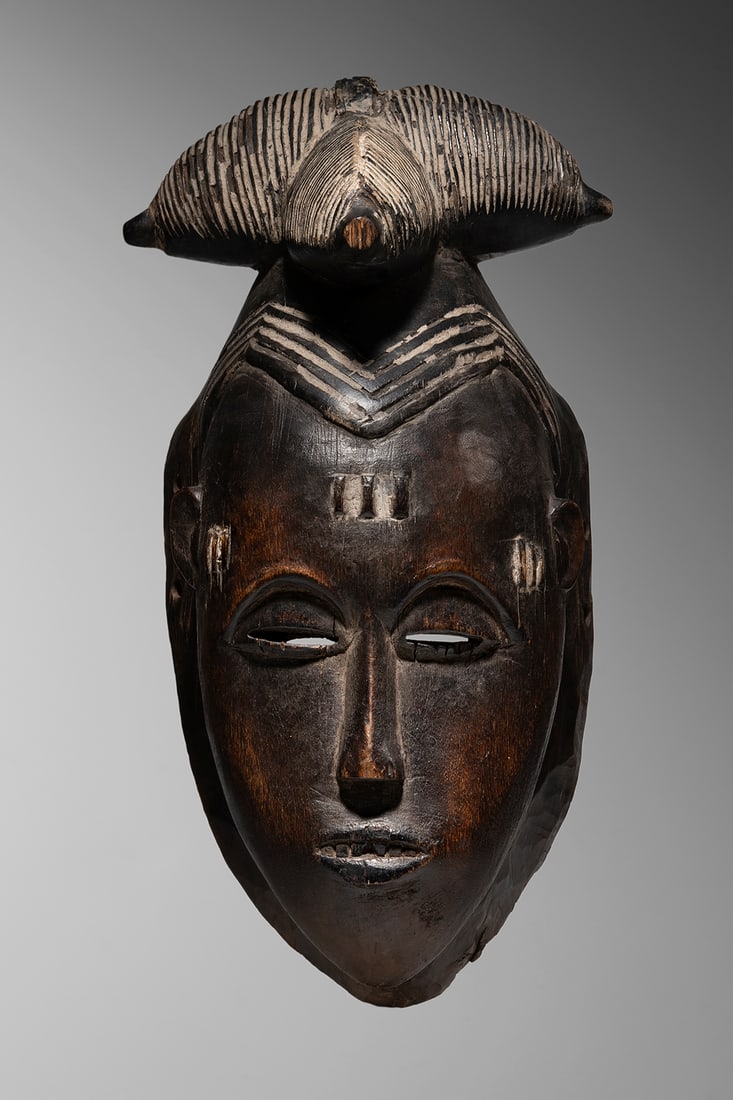 Guro Mask: Ivory Coast Wood and natural pigments 31 cm Provenance: Adrian Schlag, Brussels Private collection, Paris