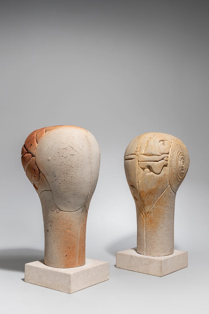 Antoine De Vinck (Belgian, 1924-1992): Two Heads - 1979 Stoneware and pigment 38 cm and 39 cm (+ base 4,5 cm) Monogrammed on verso along lower edge Provenance: Galerie Galuchat, Brussels Private collection, Antwerp 