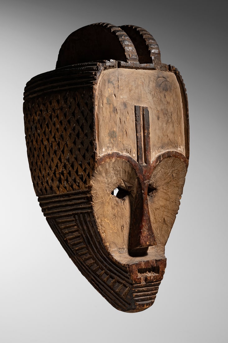 Fang Mask: Gabon - late 19th c Wood and pigments 39 cm Old label on the inside: "no. 81 Masque Fang du Sud du Gabon (très rare)" Painted inventory number: "RG, 50" Provenance: Adolphe Feder