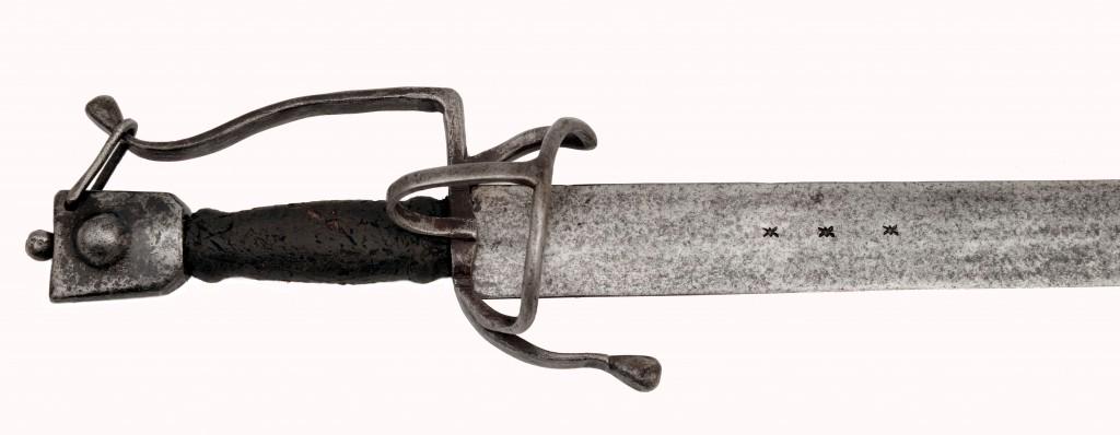 Schiavona with Pre-basket-hilt Form: Straight double-edged blade of lenticular cross section with unidentified armourer's marks. Iron hilt of flat bars with one quillon curved towards the blade ending in a drop, S-shaped knuckle bow at t