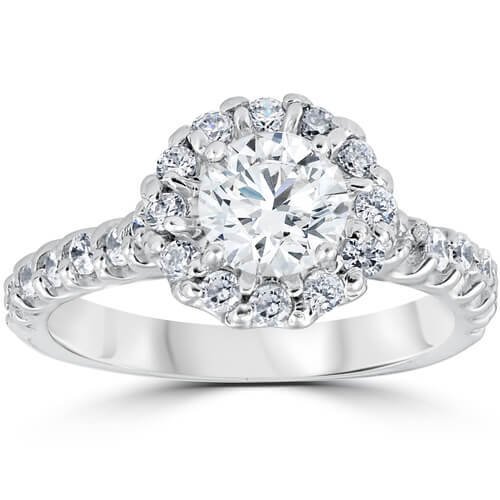 1 3/8ct Halo Diamond Engagement Ring: Width: 3Weight: 4 gMetal: 14k White GoldDiamond Carat: 1.4Diamond Cut: RoundDiamond Color: G/HDiamond Clarity: I1Diamond Treatment: NaturalDiamond Quantity: 27Diamond Setting: Prong This womens ring f