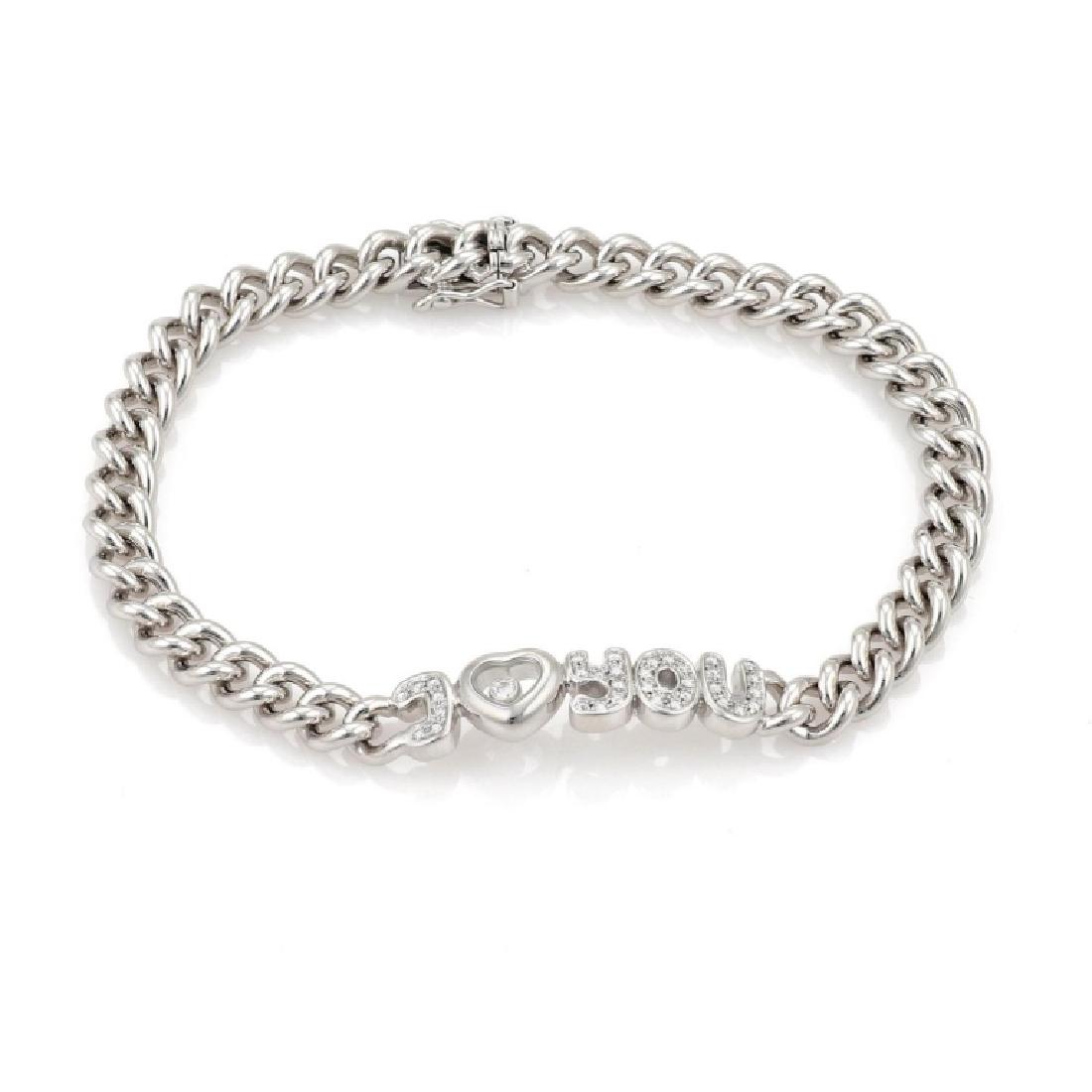 Chopard Happy Diamond 18k Gold Curb Link Bracelet: Chopard Happy Diamond "I Love You" 18k White Gold Curb Link Chain Bracelet This gorgeous authentic bracelet is by Chopard from the Happy Diamond collection. It is crafted from 18k white gold with a hi