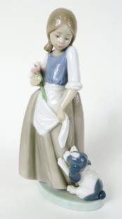 LLADRO GIRL WITH DOG: LLADRO GIRL WITH DOG, Lladro porcelain figure featuring a girl in dress holding a bouquet with a dog. Item in Good Condition. Measures: 9.0 inches high X 3.0 inches wide. Third Party Shipping Required