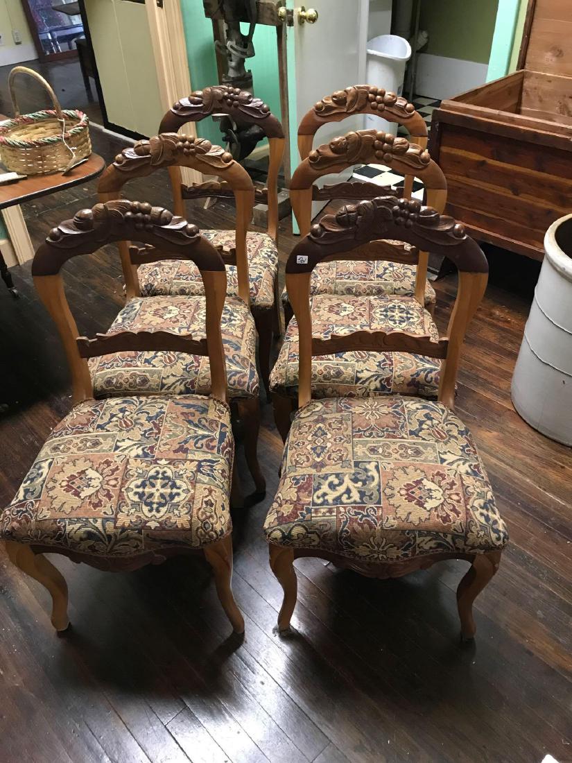 Set of 6 vintage balloon back chairs. Maple and Walnut.: Set of 6 vintage balloon back chairs. Maple and Walnut. The tops show 6 different carvings. Ca. 1860. Innerspring seats. Very good condition!
