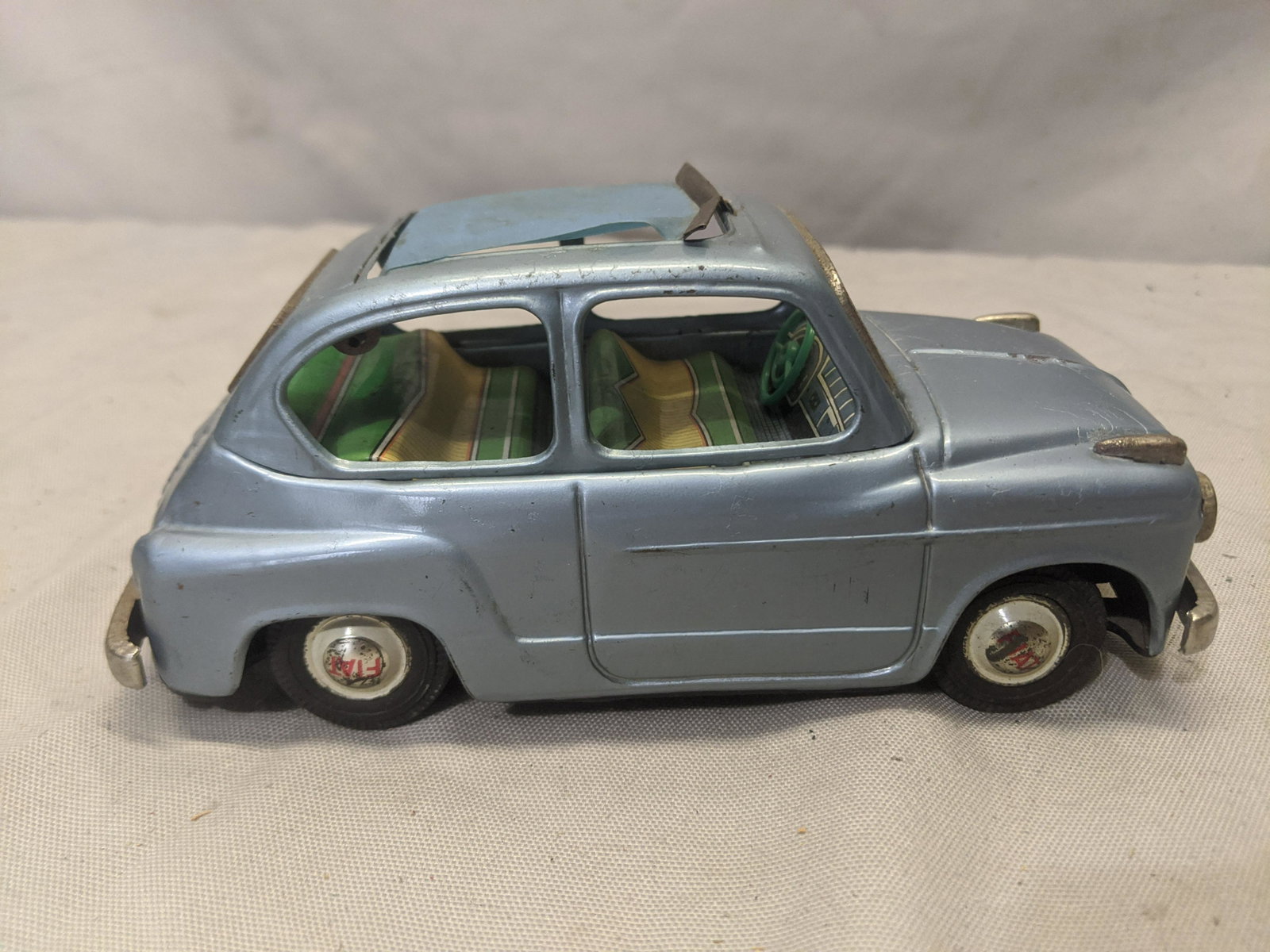 1960's Bandai Japan Tin Friction Fiat 600 Car: 1960's Bandai Japan Tin Friction Fiat 600 Car 7 long Shipping in continental US $10.00 If shipping is $0 then buyer arranges pick up or shipping. Please ask any questions before bidding Good Luck!